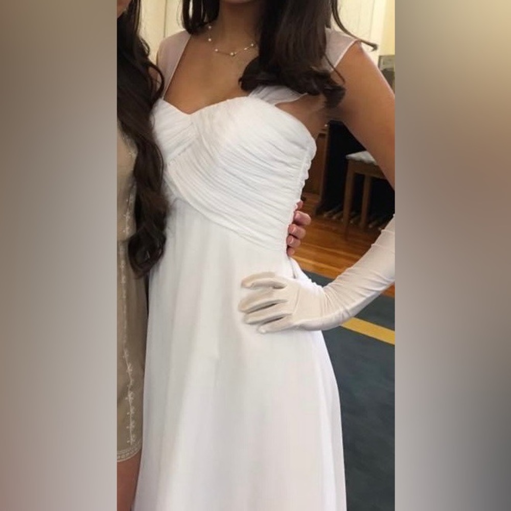 White floor length gown with sheer straps